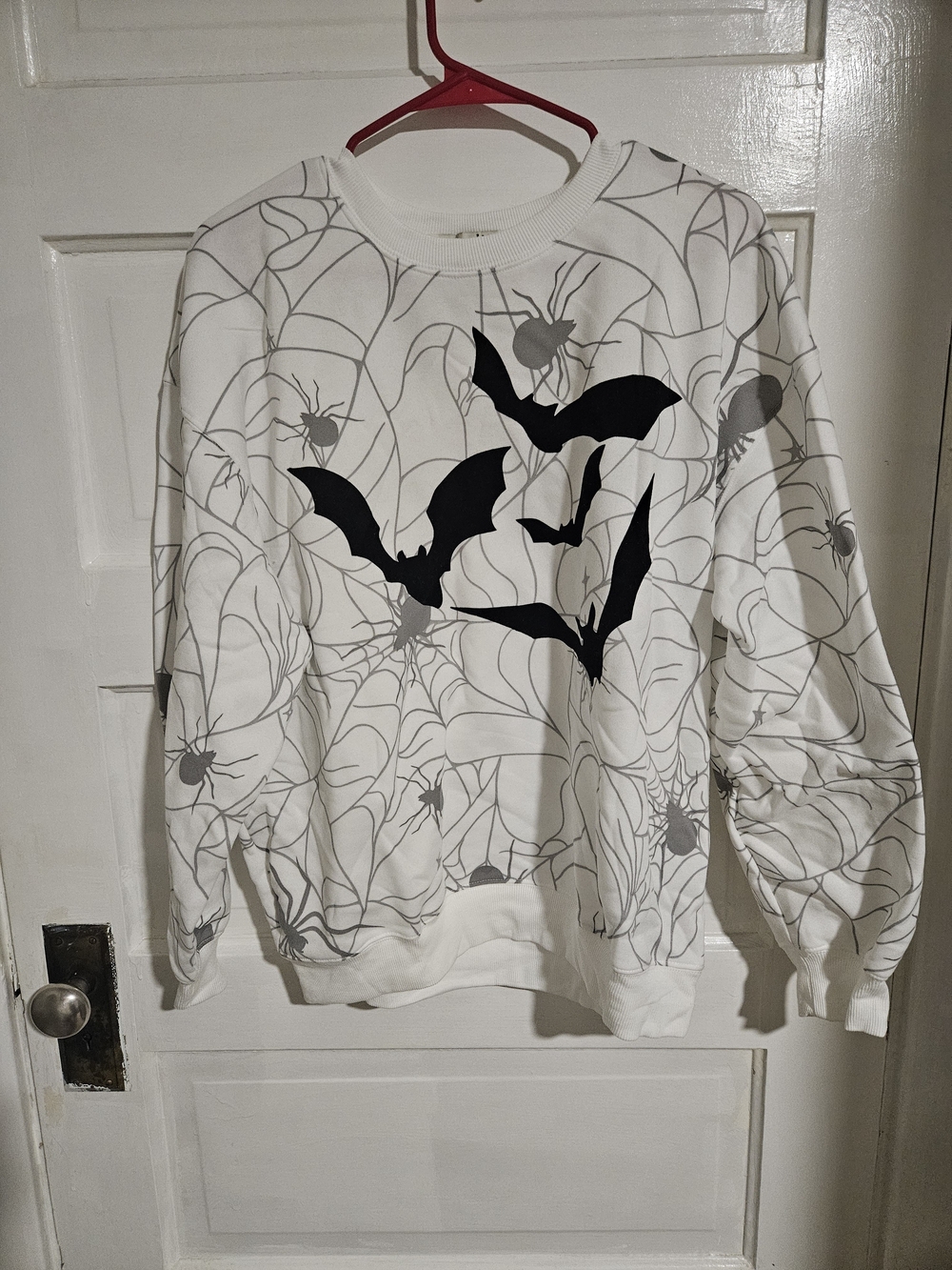 Wound Up White Sweatshirt with Black Bat & Gray Spiderwebs